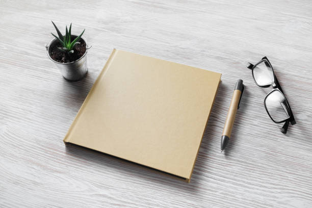 istock Book, glasses, pen, plant 1150554723