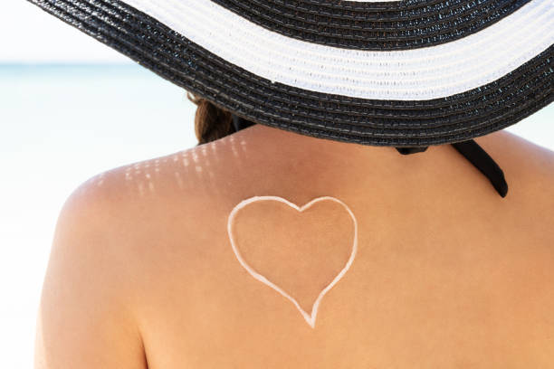 istock Sunscreen Lotion With Heart Shape Drawn On Woman's Back 1150556614