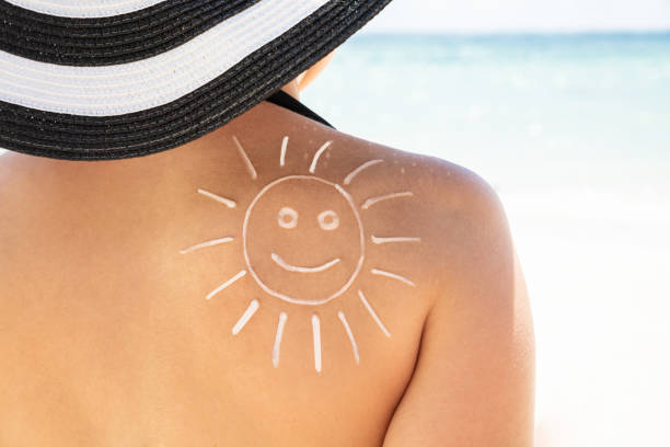 istock Sun Drawn With Sunscreen Lotion On Woman's Back 1150556616