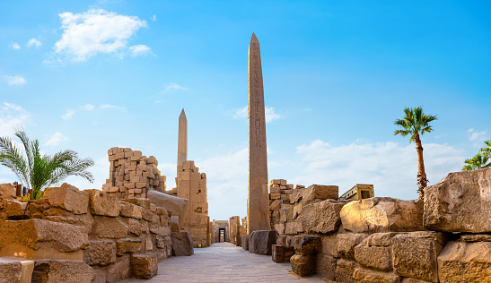 Obelisks and ruins of Karnak temple in Luxor at sunrise, Egypt