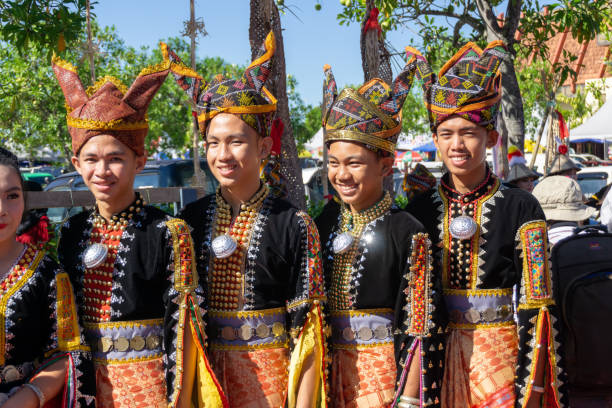 Malaysia Borneo Natives in Traditional Attire Kota Kinabalu, Malaysia - May 31, 2017: Group of young Kadazan Dusun people in traditional indigenous Borneo attire during Kaamatan Harvest Annual Festival in KDCA Sabah. kadazandusun stock pictures, royalty-free photos & images
