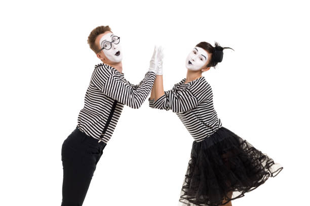 istock Smiling mimes in striped shirts. 1150559905