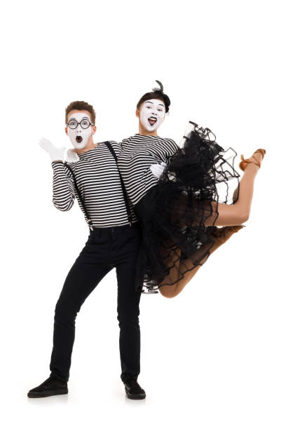 istock Smiling mimes in striped shirts. 1150559928
