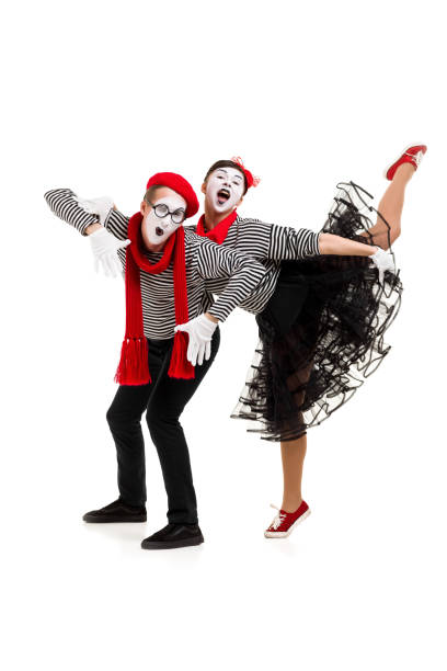istock Smiling mimes in striped shirts. 1150560078