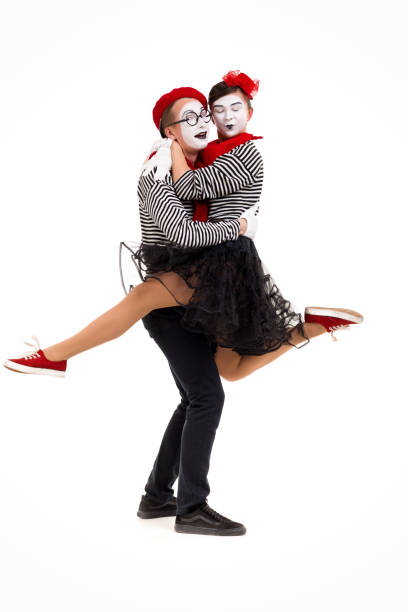 istock Smiling mimes in striped shirts. 1150560181