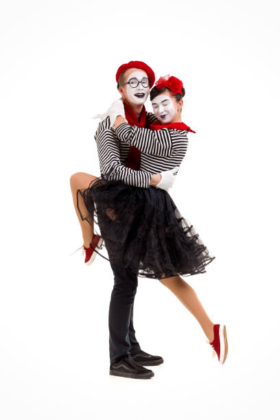 istock Smiling mimes in striped shirts. 1150560226