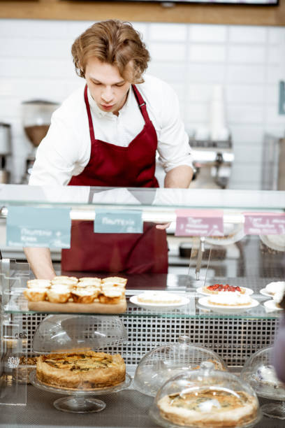 istock Salesman working at the pastry shop 1150560330