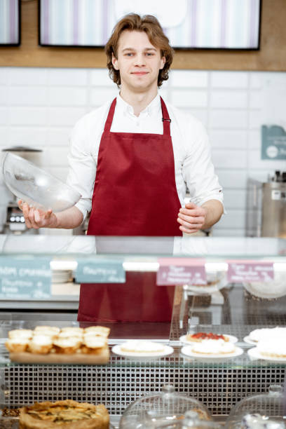 istock Salesman at the pastry shop 1150560350