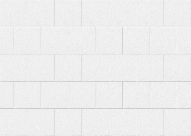istock White square tiles with rough surface. White tiles background. 1150560469