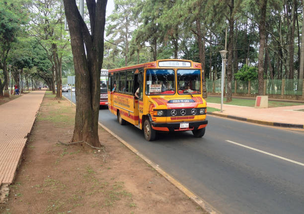 Paraguay - Ciudad del Este - Typical paraguayan local public bus on route 5 going along abstract city street