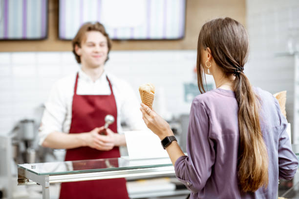 istock Man selling ice cream in the shop 1150561771