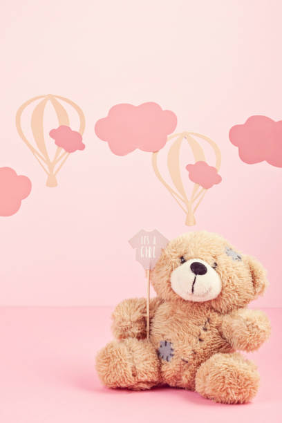 Cute teddy bear over the pink pastel background with clouds and ballons Cute teddy bear over the pink pastel background with clouds and ballons. Baby shower, girl birthday concept pink teddy bear stock pictures, royalty-free photos & images