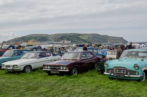 Llandudno, UK - May 5, 2019: Visitors to the Llandudno Transport Festival 2019 enjoy the displays and exhibits. The Llantransfest is held in conjunction with the annual Victorian Extravaganza.