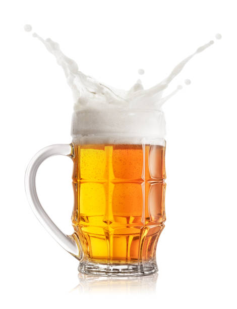 istock Foamy splash of light beer in faceted mug 1150567149