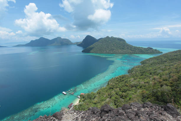 istock White sandy beach and clear blue sky view 1150568084