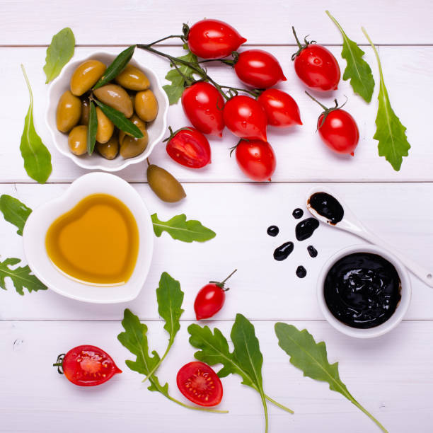 salad with vegetables, olives, olive oil and balsamic vinegar