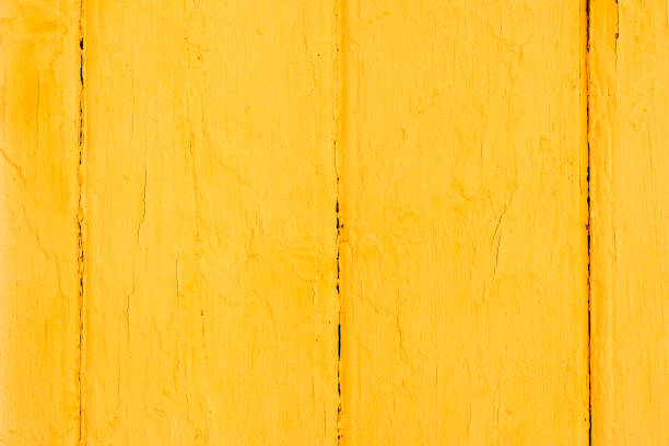 Yellow wood texture. Old wooden painted surface with flaky paint. Copy space background
