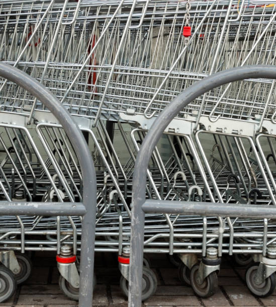 istock A row of parked shopping carts (trolleys) 1150568380
