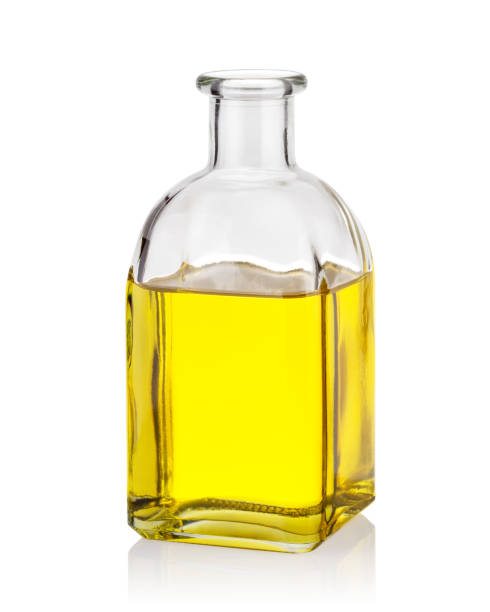 istock Yellow oil in glass bottle 1150568400