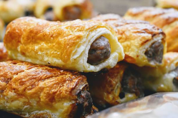 Sausage rolls Pork and sage sausage rolls baked in a golden puff pastry sausage roll stock pictures, royalty-free photos & images