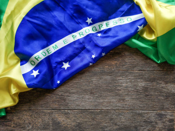 istock Brazilian flag with wooden background 1150570335