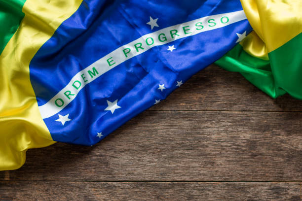 istock Brazilian flag with wooden background 1150571159