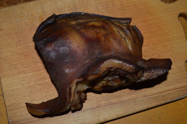 istock Smoked pork carcass on a wooden stand 1150571542