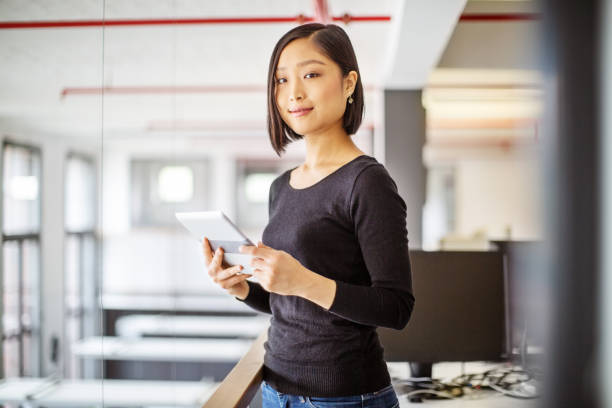 istock Confident businesswoman standing in office 1150572025