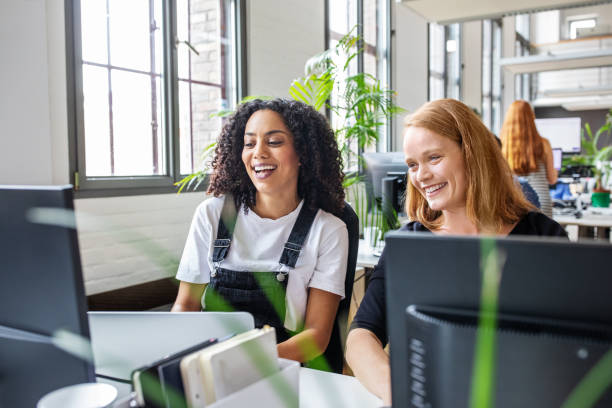 istock Happy businesswomen working together 1150572104