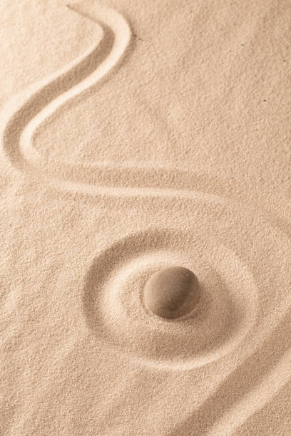 istock Yoga or zen Buddhism stone and sand background 1150577526