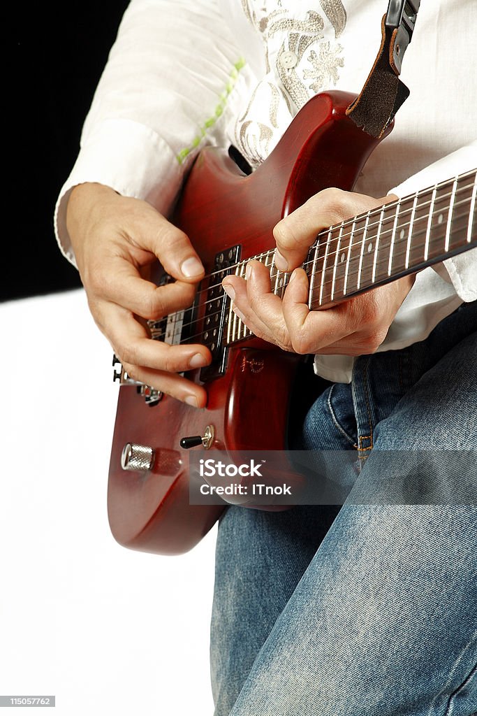 Guitar solo Young adult playing an electric guitar Adult Stock Photo