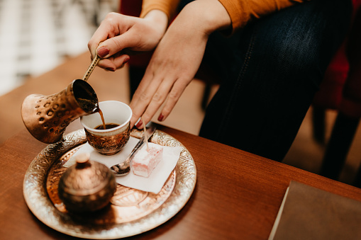 Black coffee served in traditional Turkish copper set