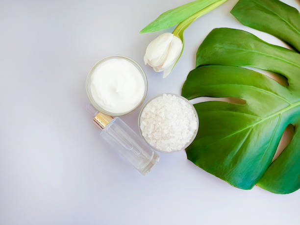 istock cosmetic cream, salt flower tulip, monstera leaf on a colored background 1150580055