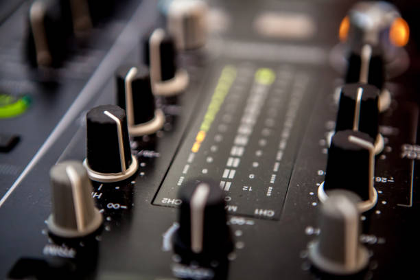 istock Close up of DJ hands mixing music on a table. 1150580404