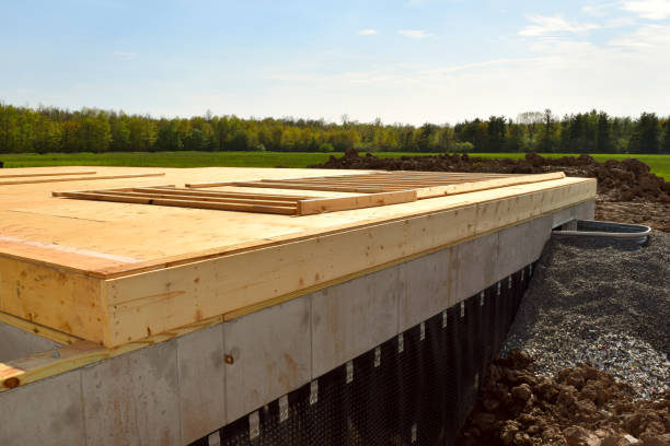 istock New Home Under Construction with Lumber Framing and Carpentry Builders Craftsman 1150580571