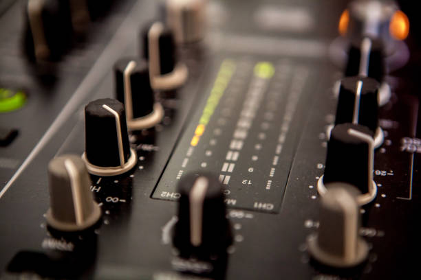istock Close up of DJ hands mixing music on a table. 1150581282