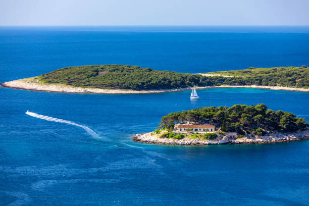 Galesnik island is the first in a row of all Pakleni islands. From this little island there is the most beautiful view at the town of Hvar. Galesnik island is the first in a row of all Pakleni islands. From this little island there is the most beautiful view at the town of Hvar. archipelago photos stock pictures, royalty-free photos & images