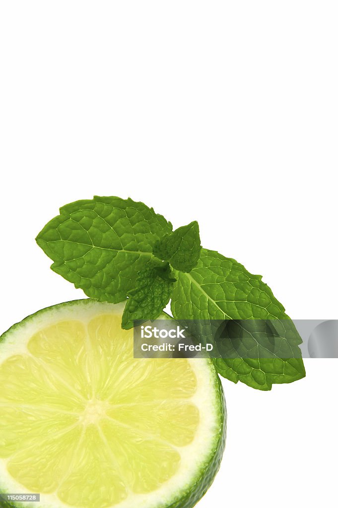 Mint and Lemon A slice of green lemon and mint leaves Citrus Fruit Stock Photo