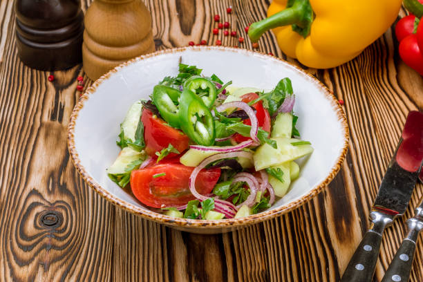 istock Vegetable salad with tomatoes and cucumbers 1150589198