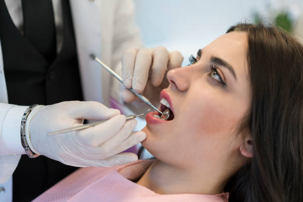 istock Young woman having teeth examined at dentists 1150590143
