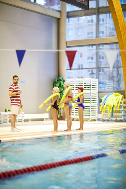 istock Swimming lesson in swimming pool 1150590308