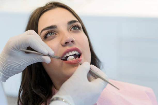 istock Young woman having teeth examined at dentists 1150591699