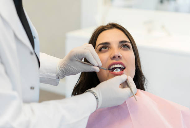 istock Young woman having teeth examined at dentists 1150592134