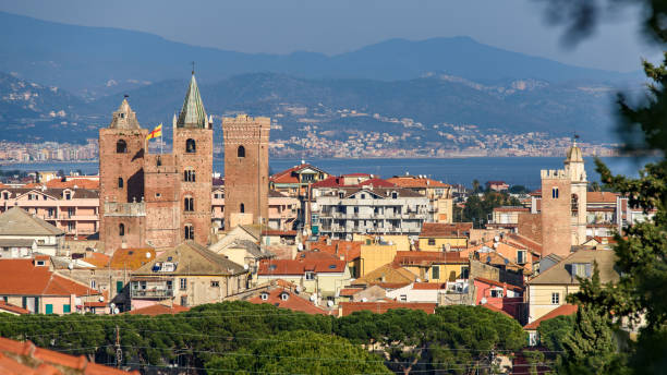 Cityscape of Albenga The medieval towers in the cityscape of the ligurian village of Albenga, situated on the italian Riviera province of savona stock pictures, royalty-free photos & images