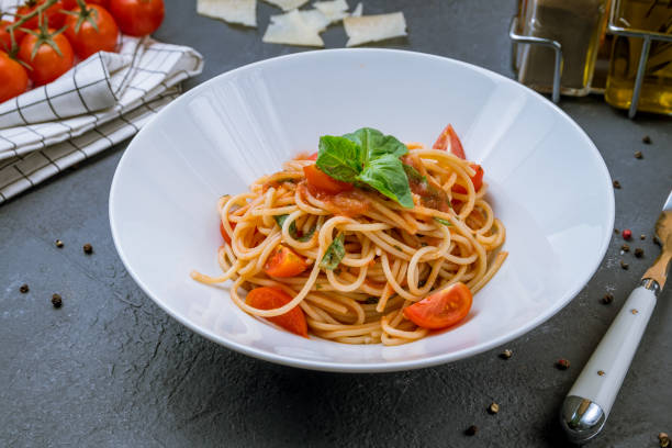 istock Spaghetti with vegetables in tomato sauce 1150592280
