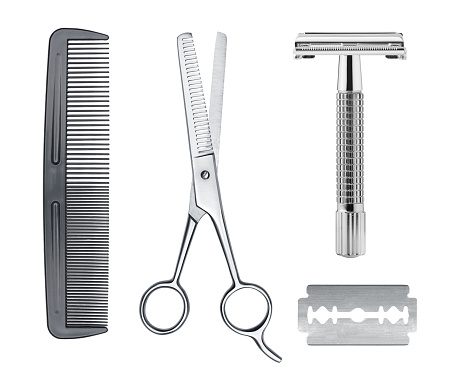 Comb, razor and scissors isolated on white background