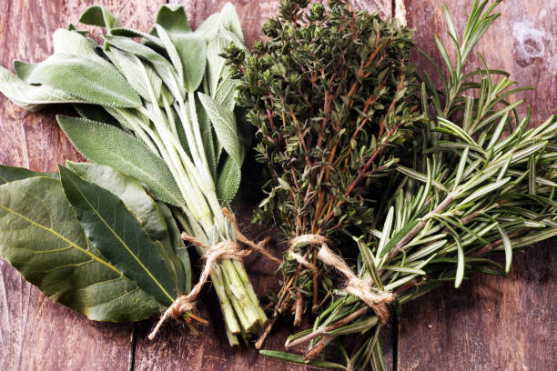 istock Homegrown and aromatic herbs on rustic background with rosemary and basil 1150594549