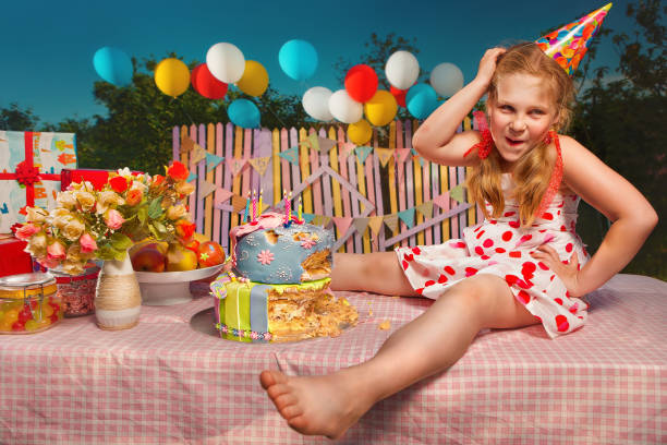 Embarrassed little girl ate almost the whole cake on the eve of the holiday