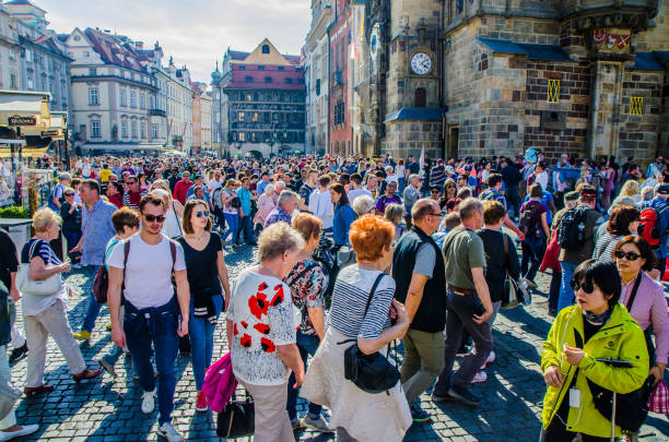 Crowd in Prague Old town Square close to the astronomical clock during day of springtime