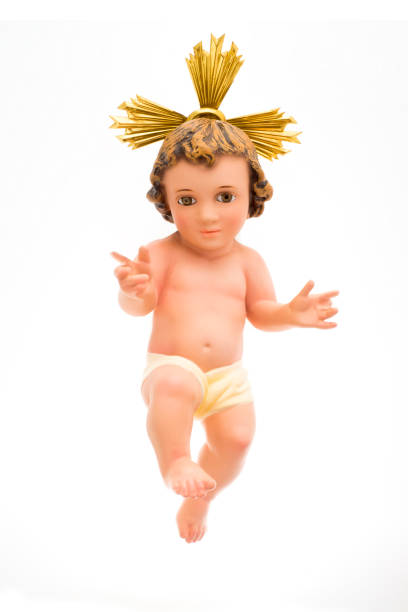 istock Ancient baby Jesus figurine, isolated on white background 1150602481